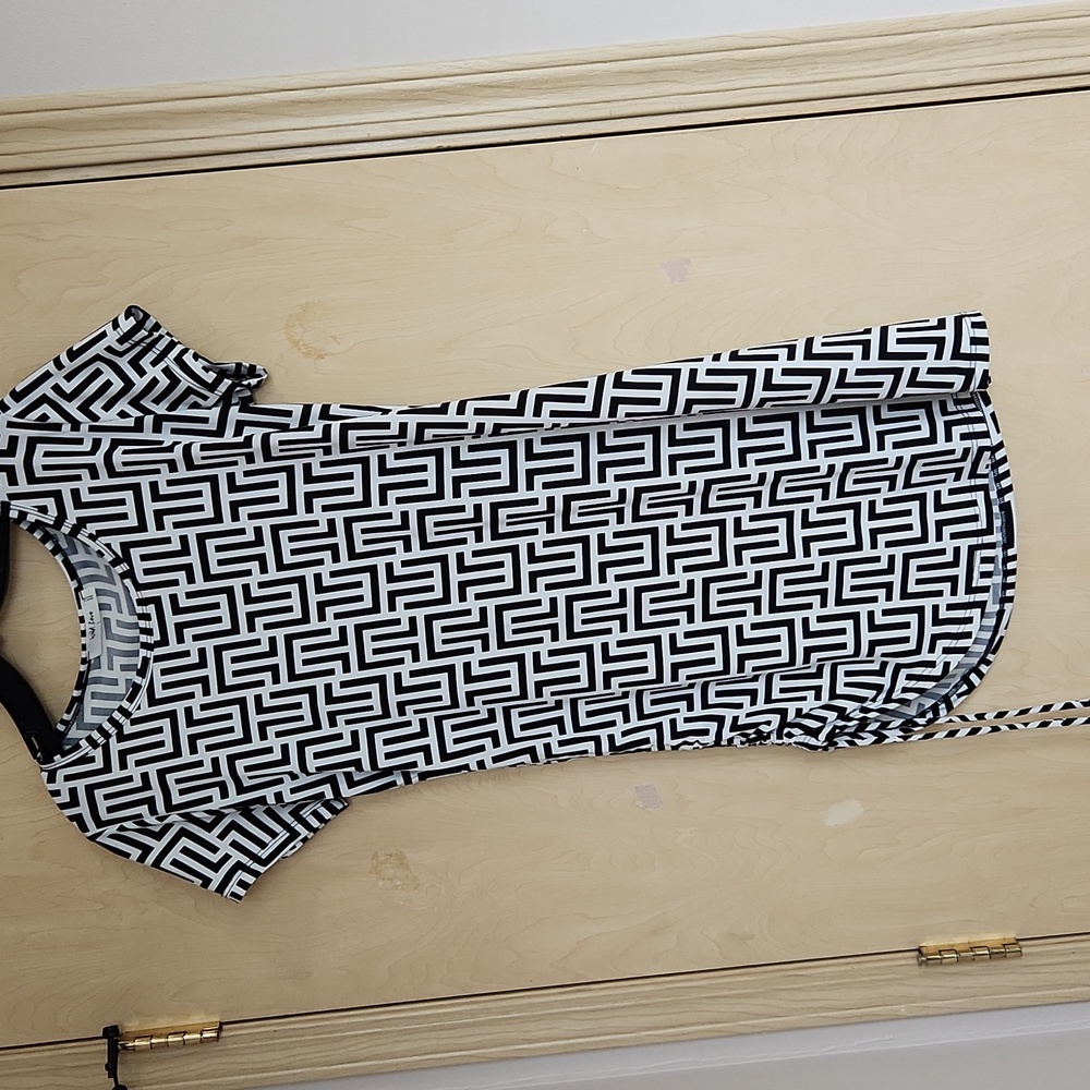 Black and white drawstring runic top.